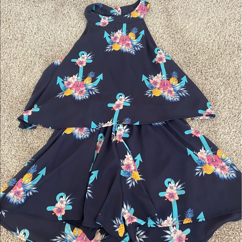 Navy romper with anchors, flowers, and pineapple